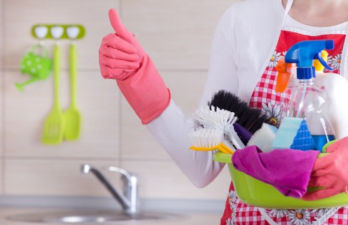 Cleaner in SW17 carrying out kitchen cleaning tasks
