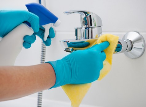 Professional carpet cleaning team following safe procedures