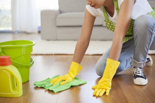 Trained technician carrying out a careful carpet cleaning assessment
